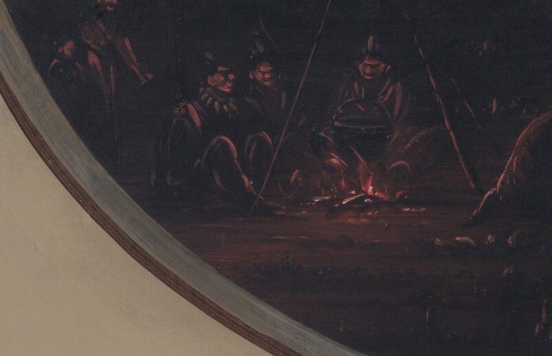 The flickering light of a campfire draws the eye to figures.