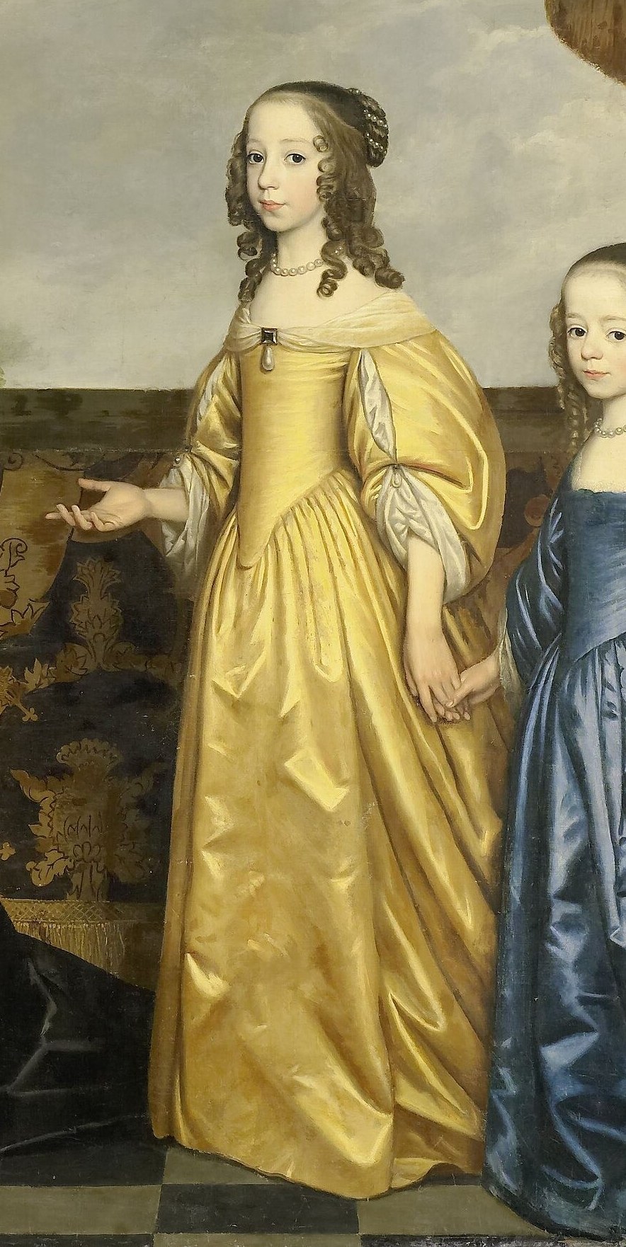 Her bright dress and poised stance suggest youth and future promise within the royal family.