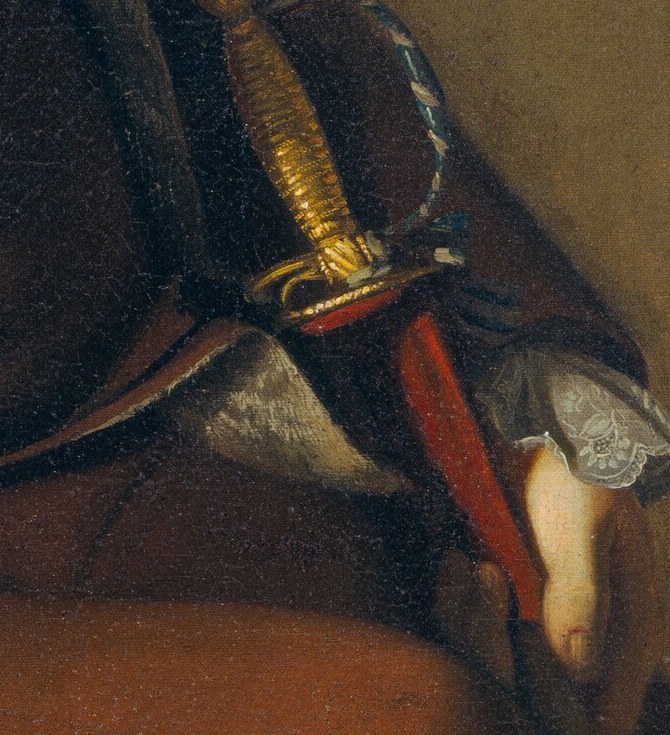 He holds his sword hilt firmly.