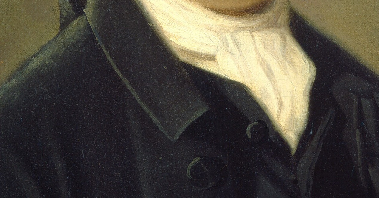 He is intensely serious, perhaps a merchant or official.