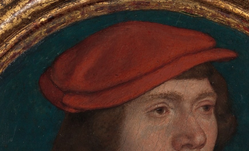 The vibrant red cap draws immediate attention, suggesting status or a specific affiliation.
