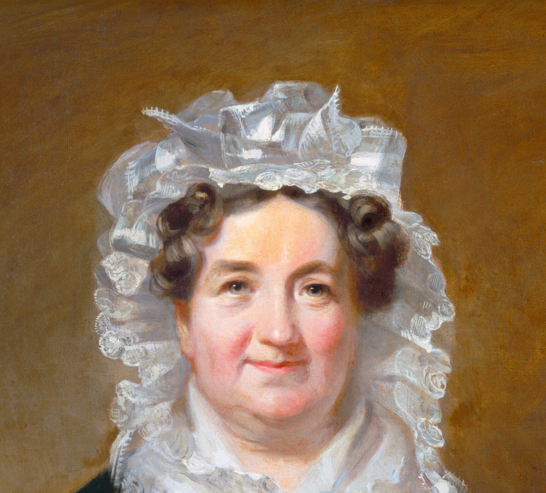 The bonnet's tiered lace ruffles dwarf the face and signal social status; its brilliant white creates the strongest value contrast in the canvas