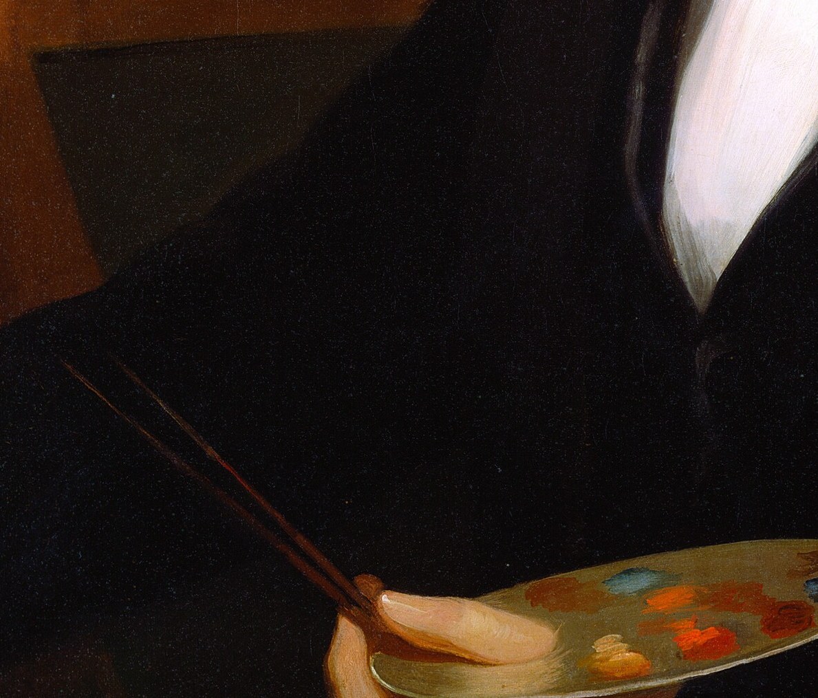 His fingers grip the thumb-hole like a man who holds one every day.