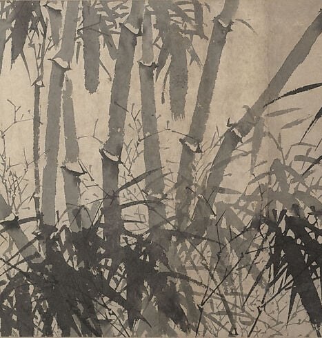 The cluster of stalks on the left provides a dense counterpoint to the sparser elements, creating visual balance.