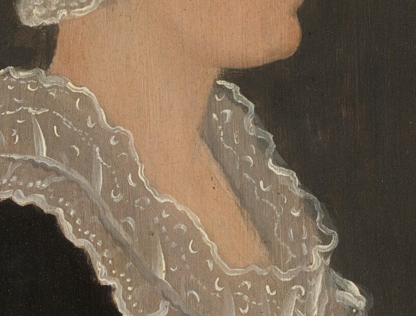 Her intricate lace collar speaks to the fashion of the era.