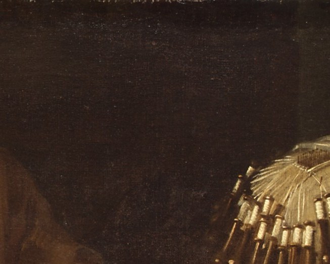 Her absorbed downward gaze anchors the painting's mood of intense concentration; the softly lit cap draws the eye immediately and contrasts with the surrounding darkness.