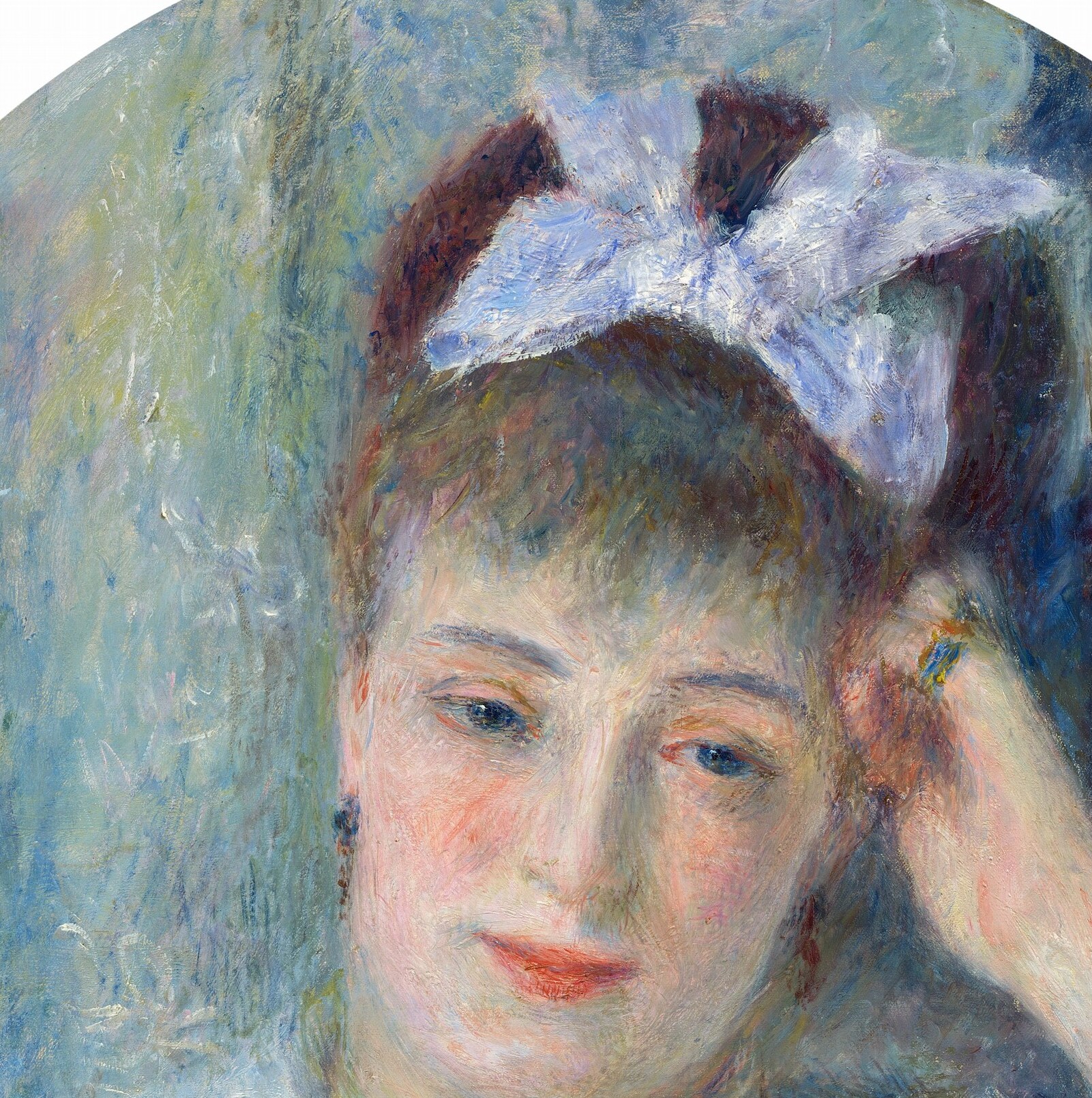 Her expression is calm, almost inward looking.