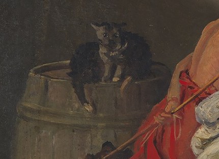 Notice the cat perched quietly on a barrel below.