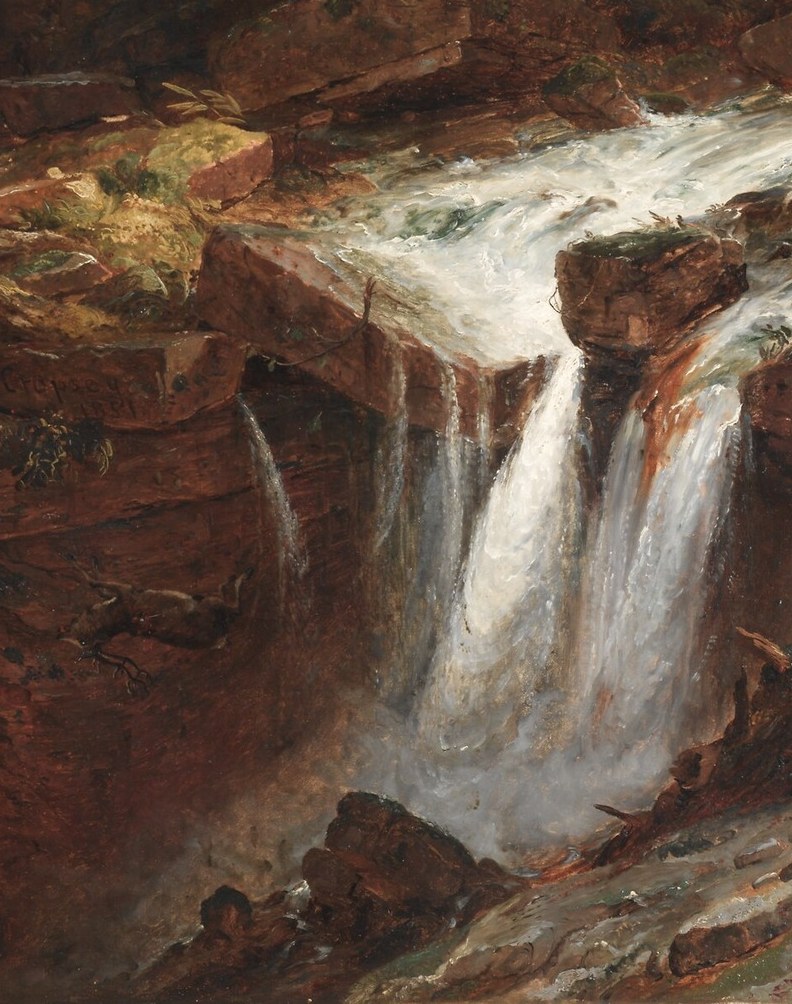 The texture and color of the rocks suggest a damp, ancient landscape shaped by water.