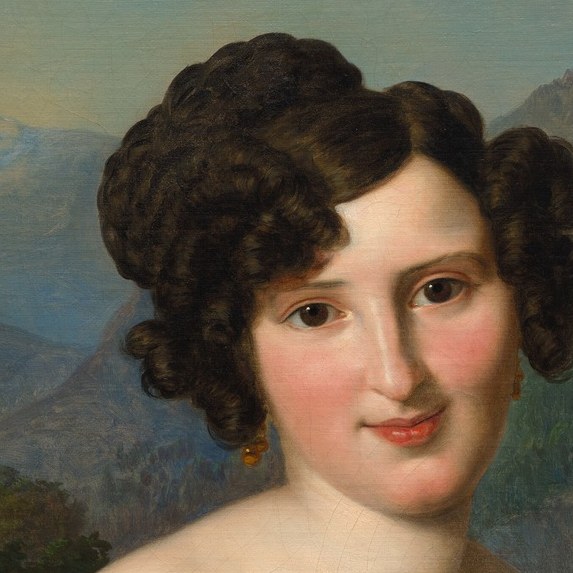 The intricate curls and volume of her hairstyle suggest the fashion of the era and add to her elegant appearance.