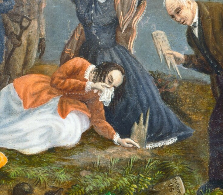 A woman kneels by a pale, prone figure.