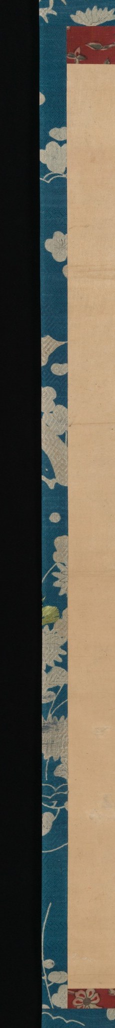 The decorative blue border with floral motifs frames the central scene and provides a rich textural contrast.