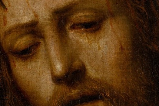His crown of thorns presses sharply into his skin.