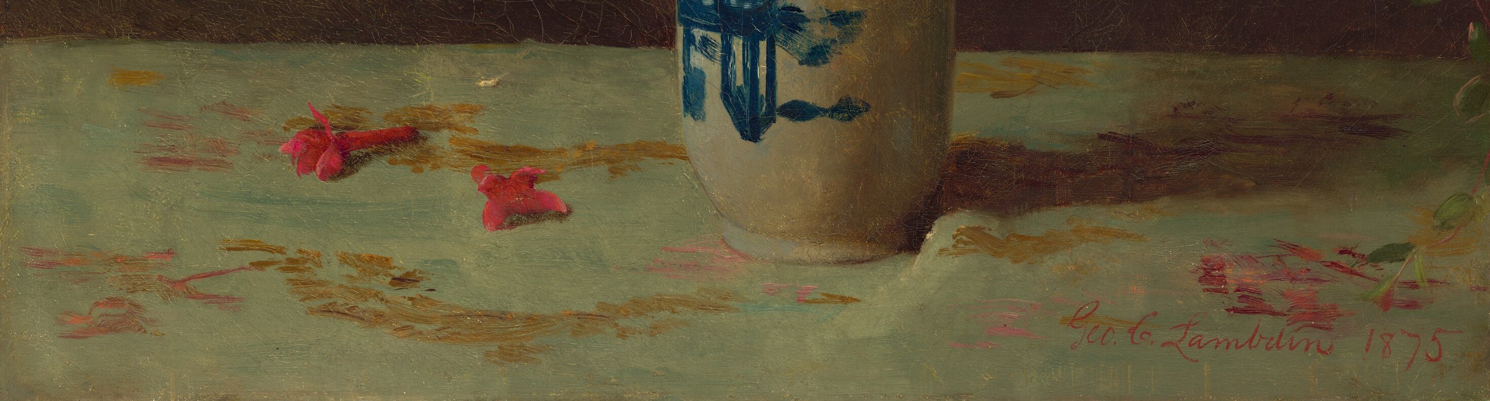 Look closely at the tablecloth beneath the vase.