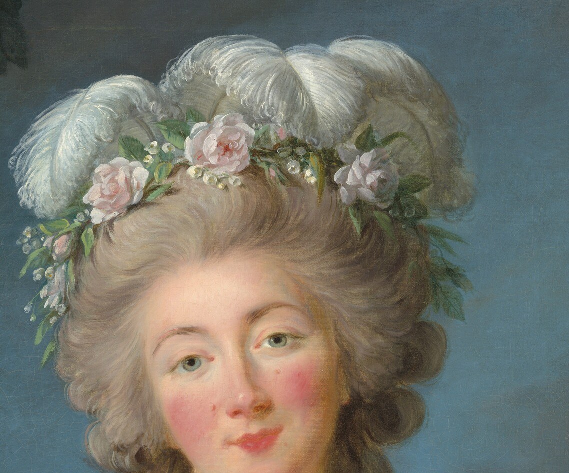 Her elaborate hairstyle and silk gown show her luxurious world.
