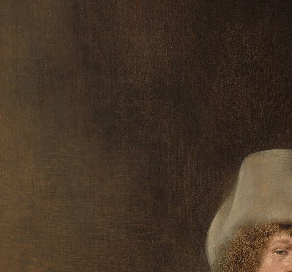 The self-portrait nucleus , relaxed, slightly smiling expression with pipe stem at the lips; unusually candid and unheroic for a 1630s self-portrait.
