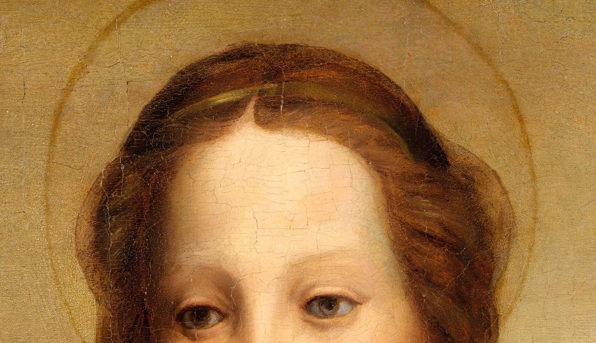 The gold halo marks her as divine.