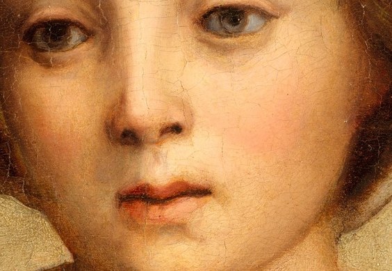 She looks down, lost in thought.