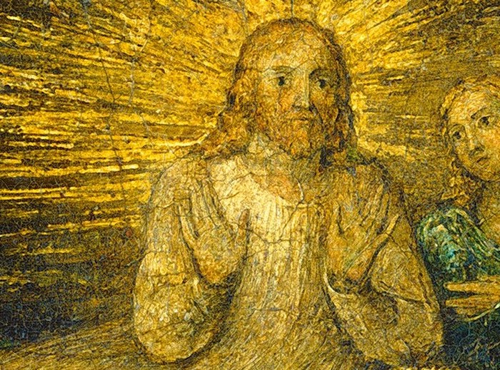 Jesus's halo burns with a spiritual, almost explosive light.