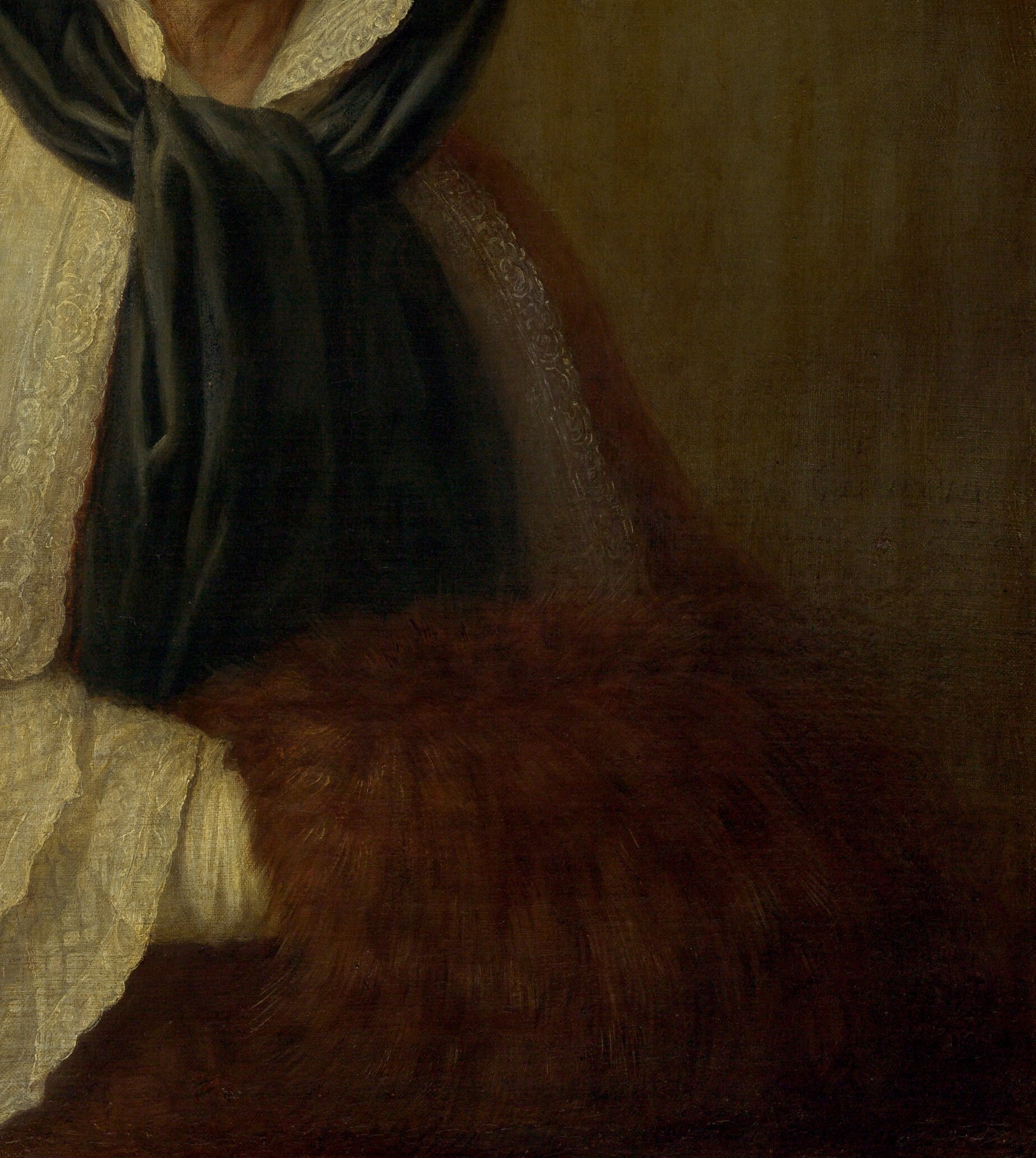 Her rich, textured cloak also suggests comfort and resilience.