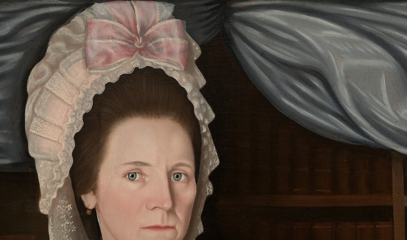 Her lace cap and fichu are the picture of gentility.