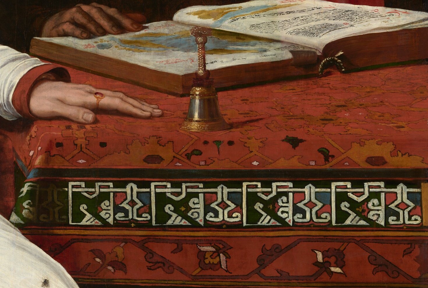 The open book likely shows a new map of the globe.