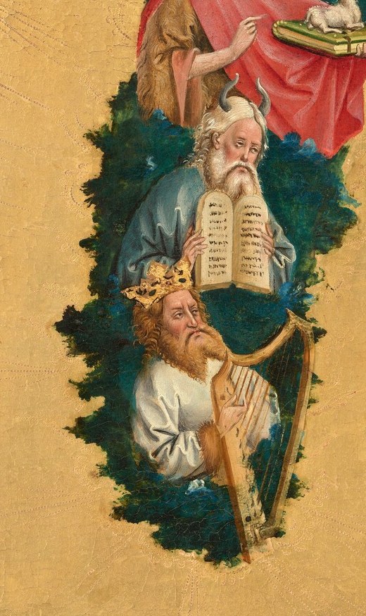 Below, an apostle holds a book, signifying scripture.