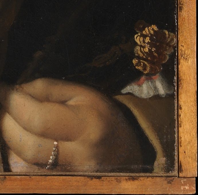 The delicate rendering of the hand, with its ring, suggests refinement and personal adornment.