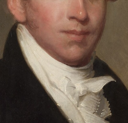 Notice the delicate lace of his collar and ruffled cravat.
