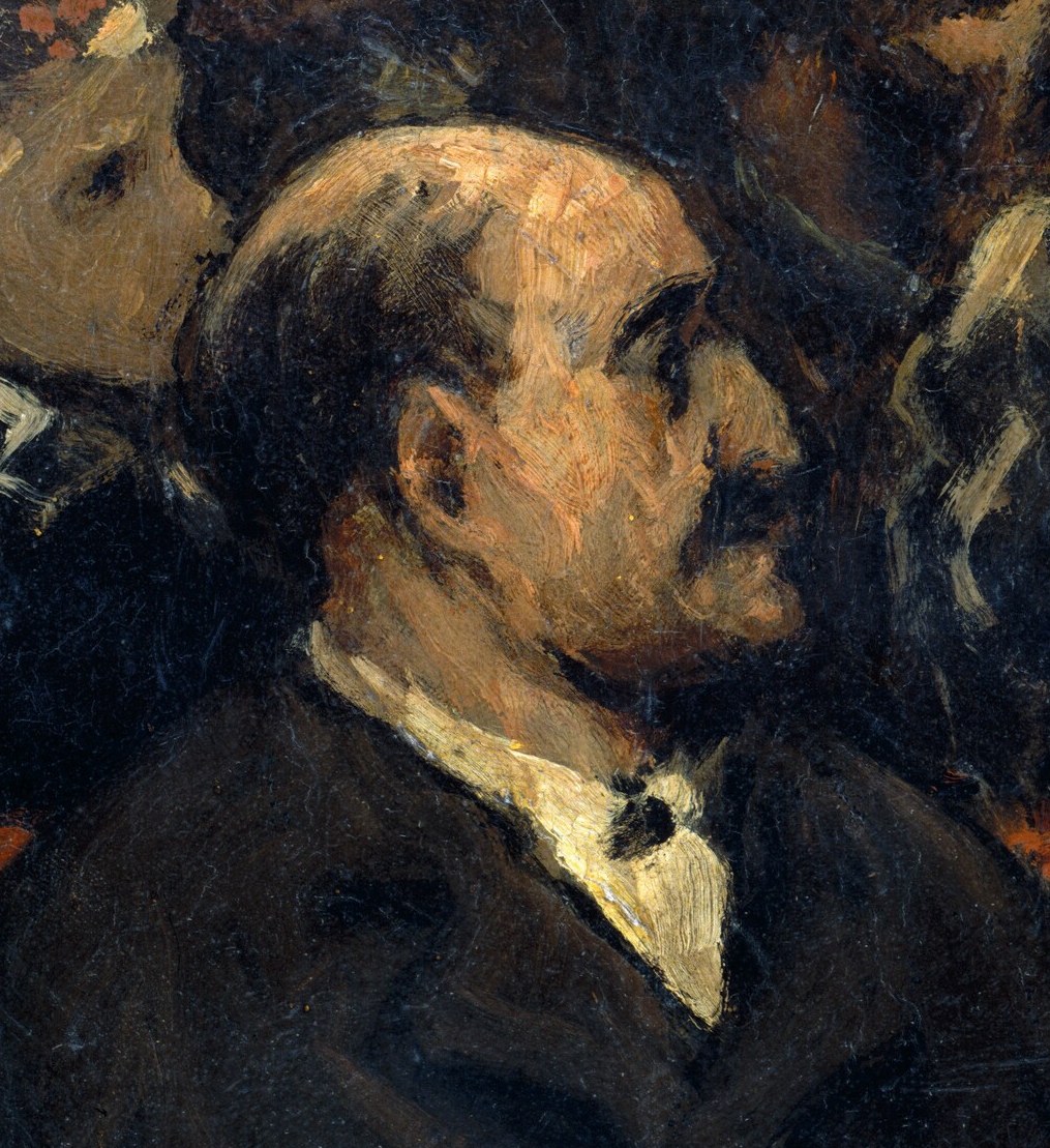His stern expression and focused gaze convey a sense of seriousness or perhaps critical observation of the event.