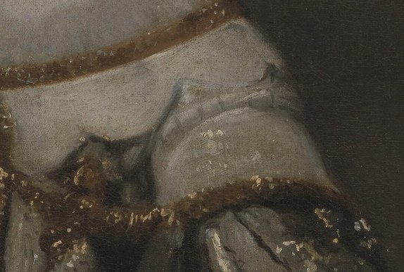 Her right hand rests on the skirt almost tentatively.