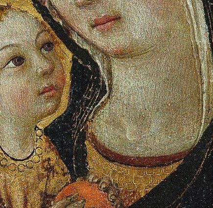 The child returns our gaze, and reaches for a pomegranate.