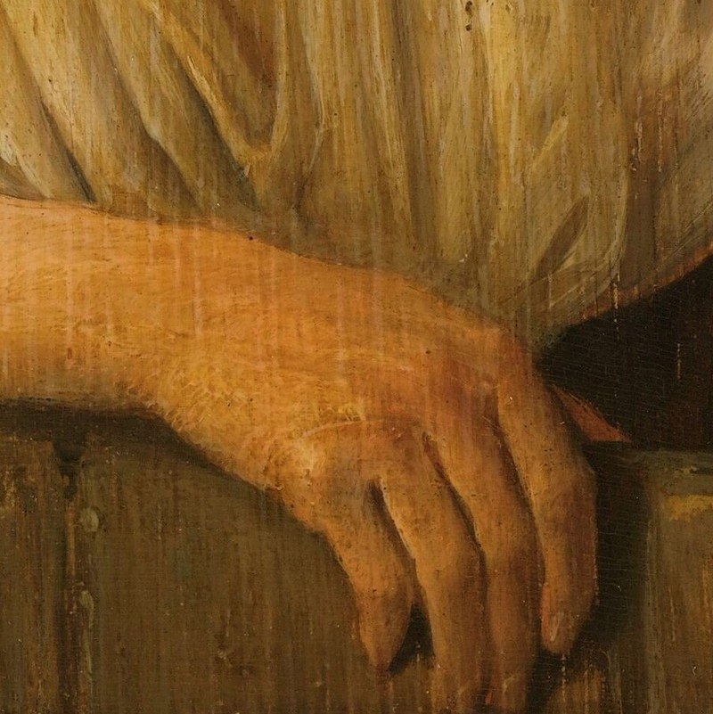 His left hand rests easy. A habit, not effort.