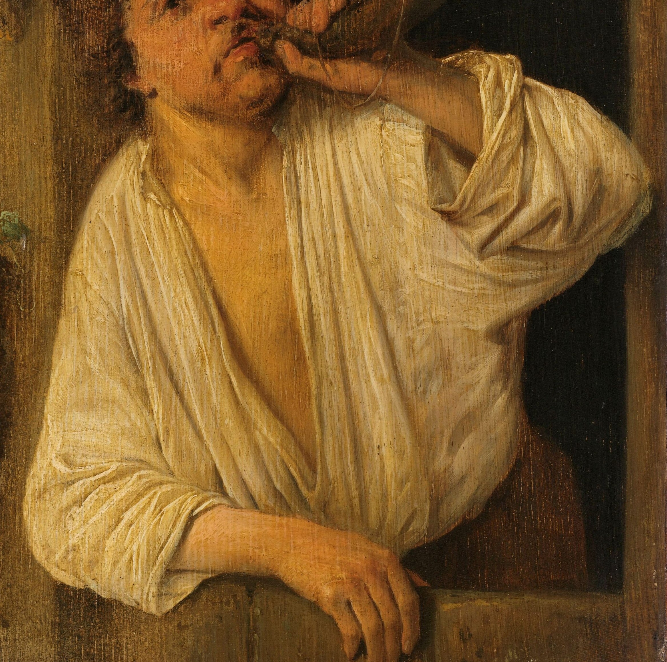 The rumpled fabric and open collar suggest a working man and add texture.