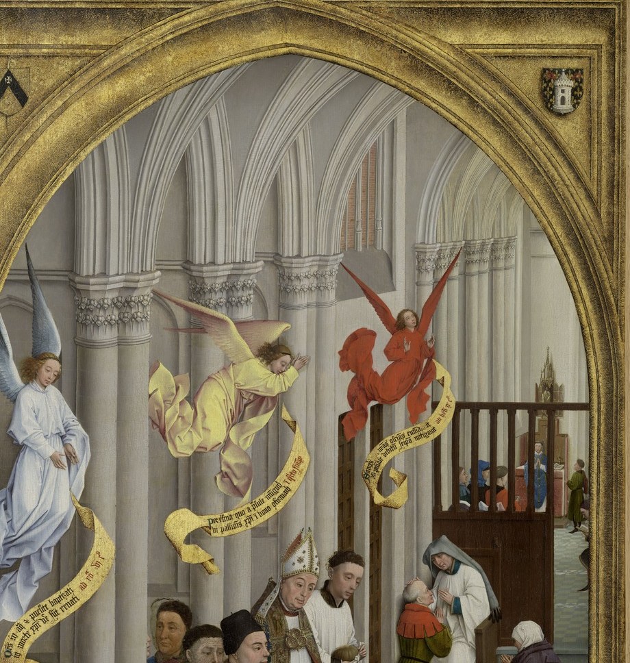 A child receives Confirmation from a mitered bishop.