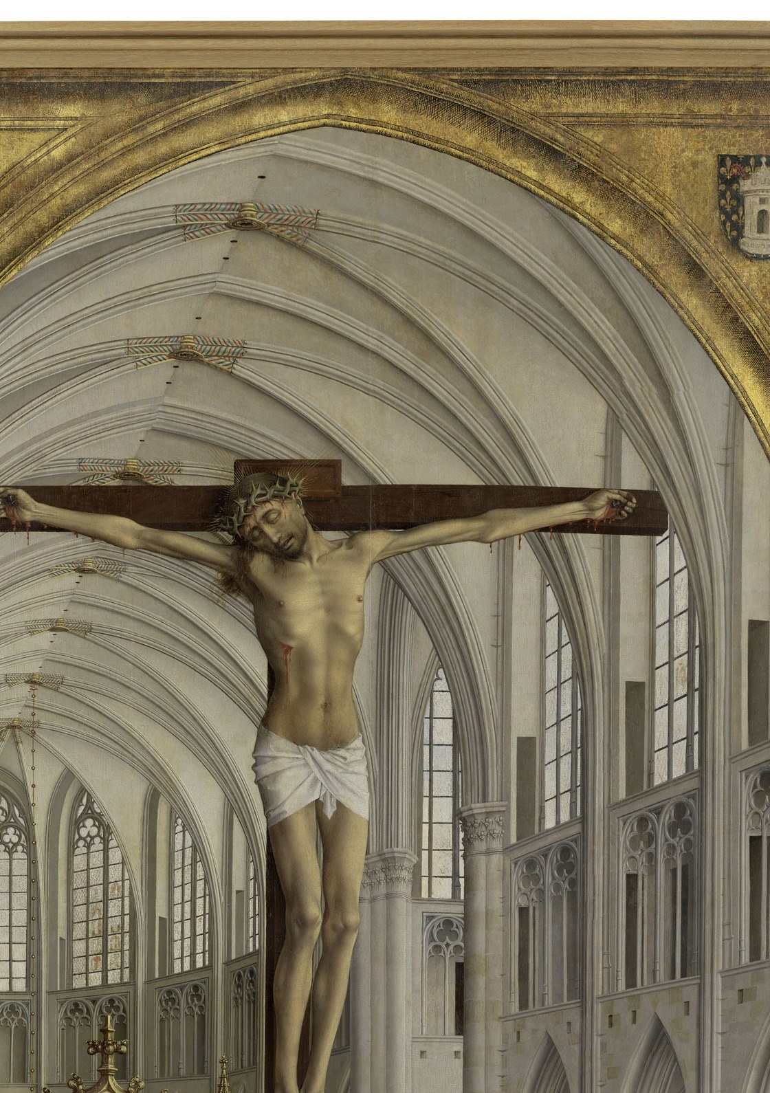 A crucifixion rises directly above an altar.
