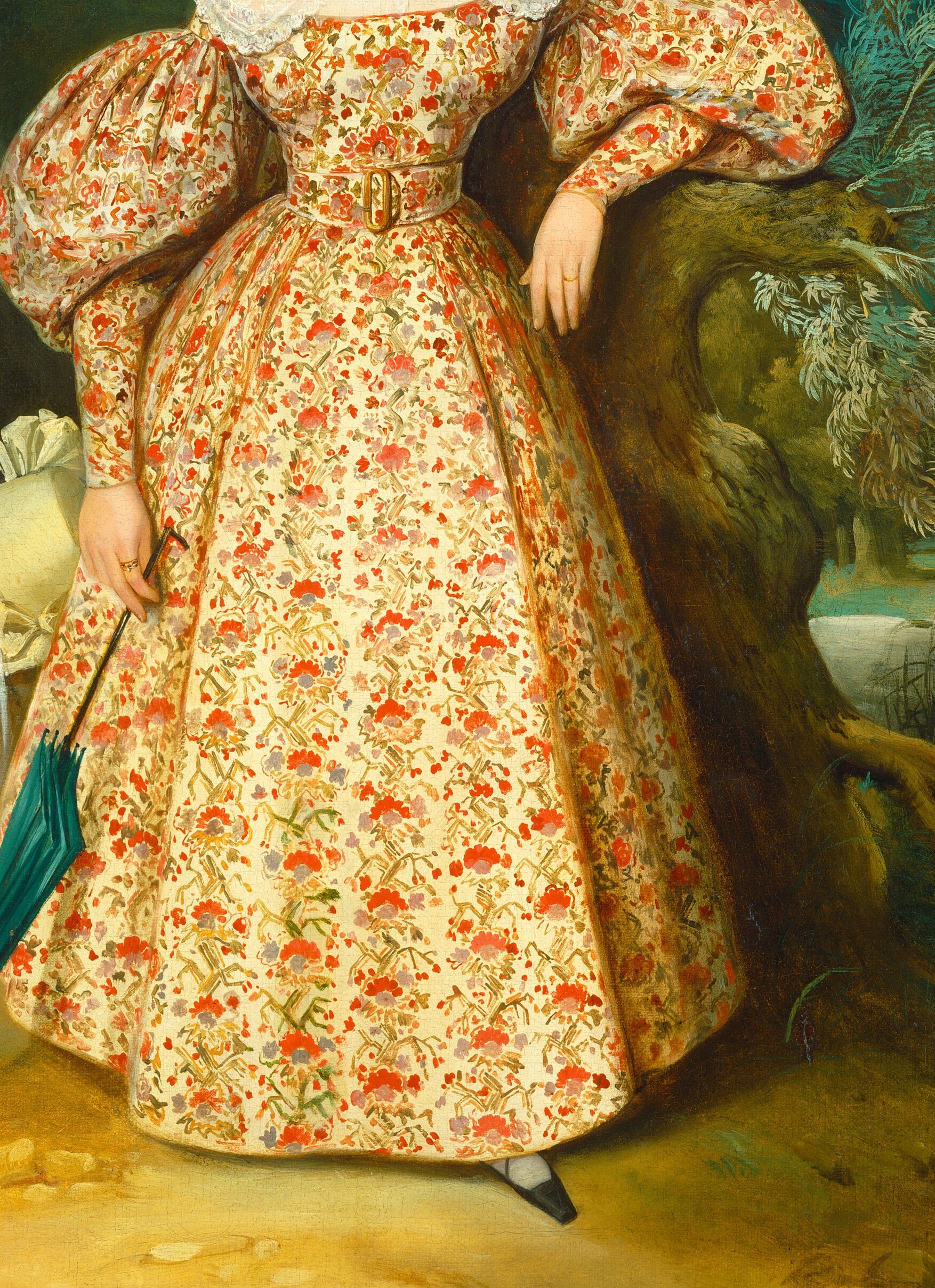 Her floral dress and straw hat suggest a leisurely day.