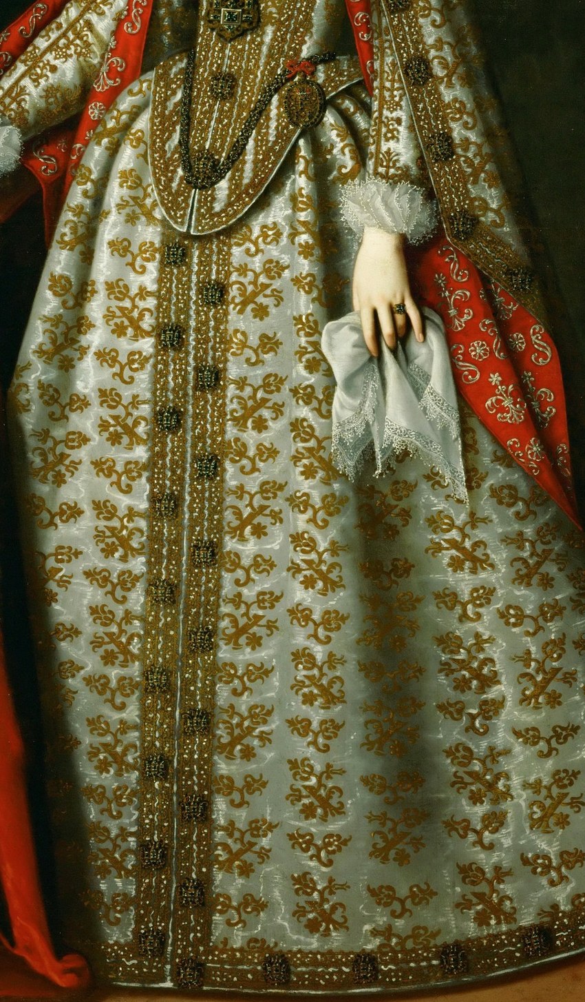 Her golden dress speaks of imperial wealth.