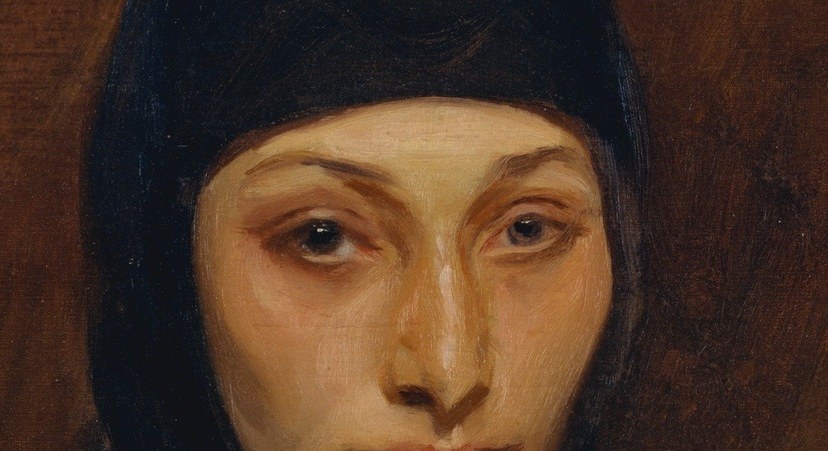 The veil frames her face, but the eyes hold you.