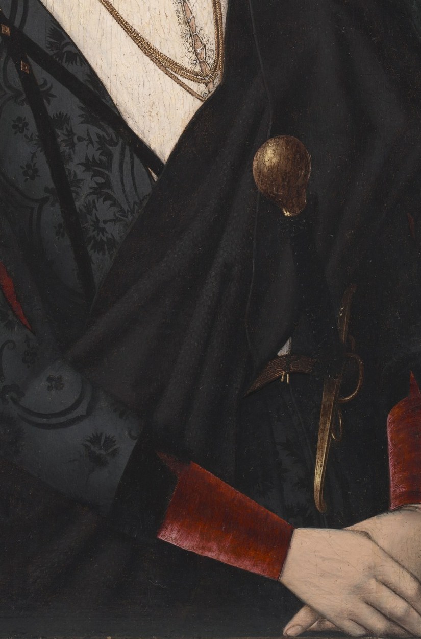 The dark fabric and sharp lapels suggest a formal attire, contributing to the sitter's dignified presentation.