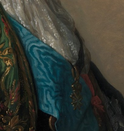 The vibrant blue sash marks him as a man of high rank.