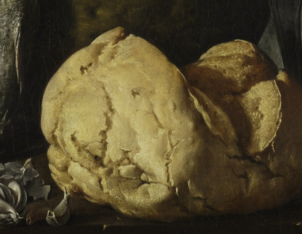 He renders the rough crust of the bread.