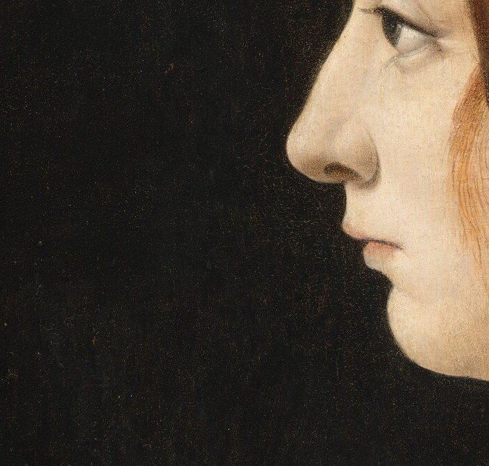 But the delicate curve of her lips holds her own quiet self.