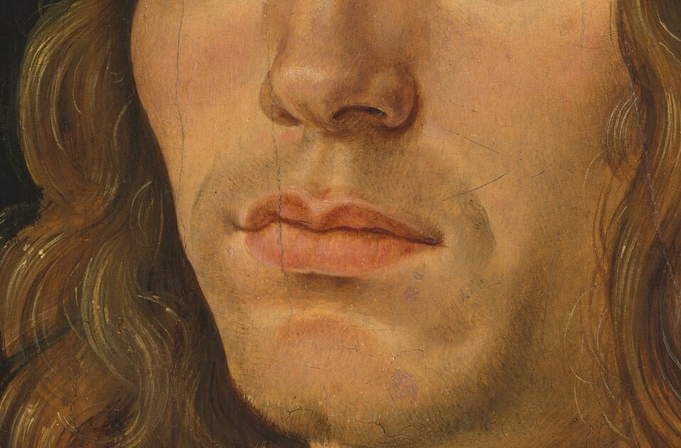 The unblinking gaze and set mouth convey a serious demeanor.
