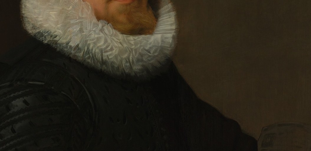 An elaborate milky-white ruff frames the dark coat like a halo; its intricate lace texture is a virtuoso passage of painting and a status symbol precisely dateable to the 1620s.