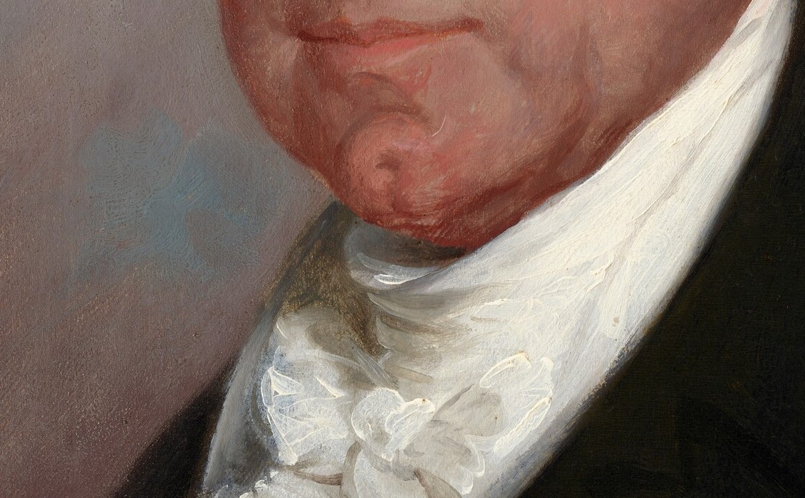 The collar frames the face. The eye has nowhere else to go.