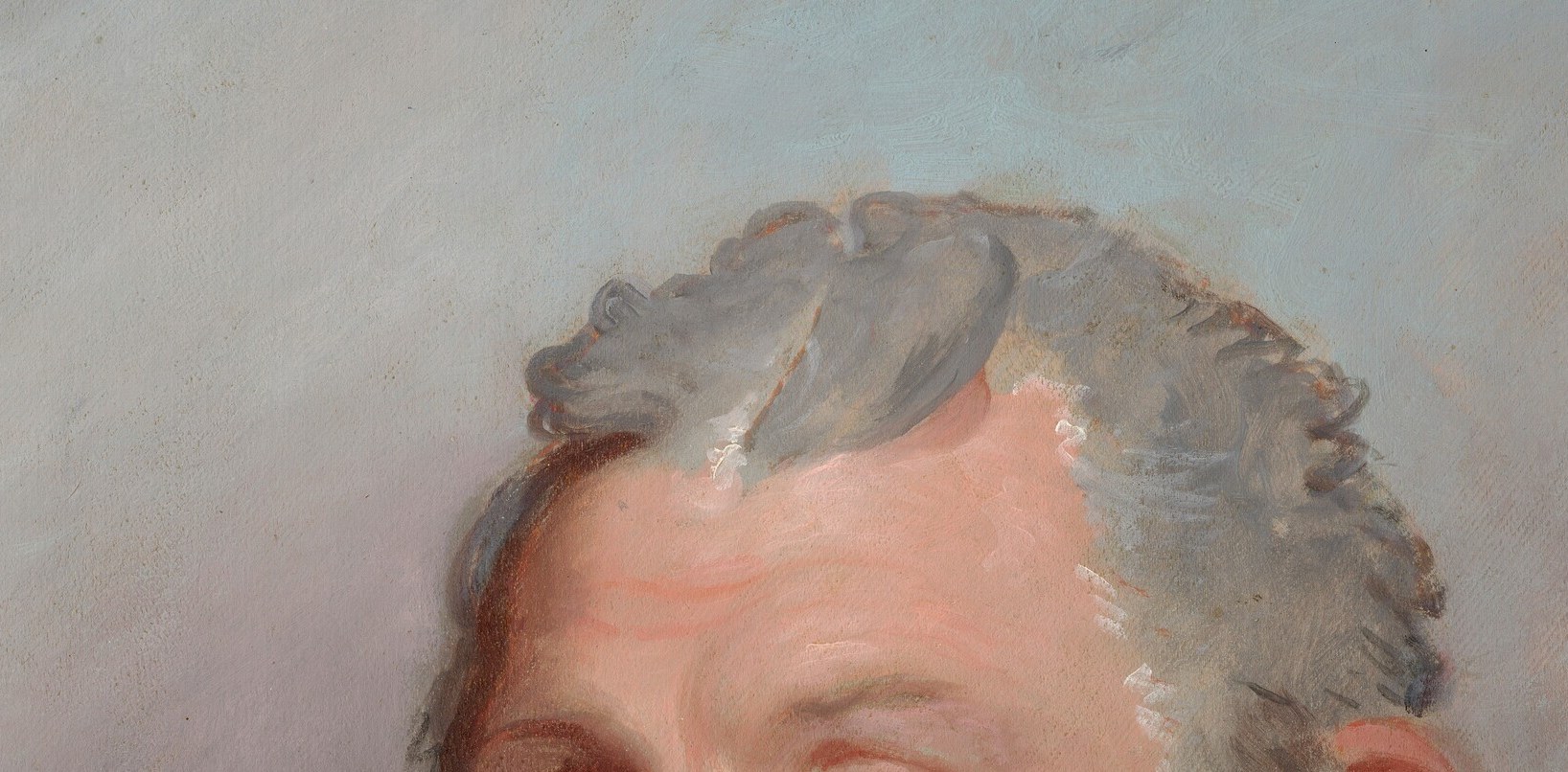 Warm amber on one side, cool grey on the other. The face floats between them.