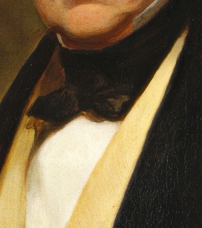 The rich color and texture of the waistcoat add a touch of opulence to his attire.