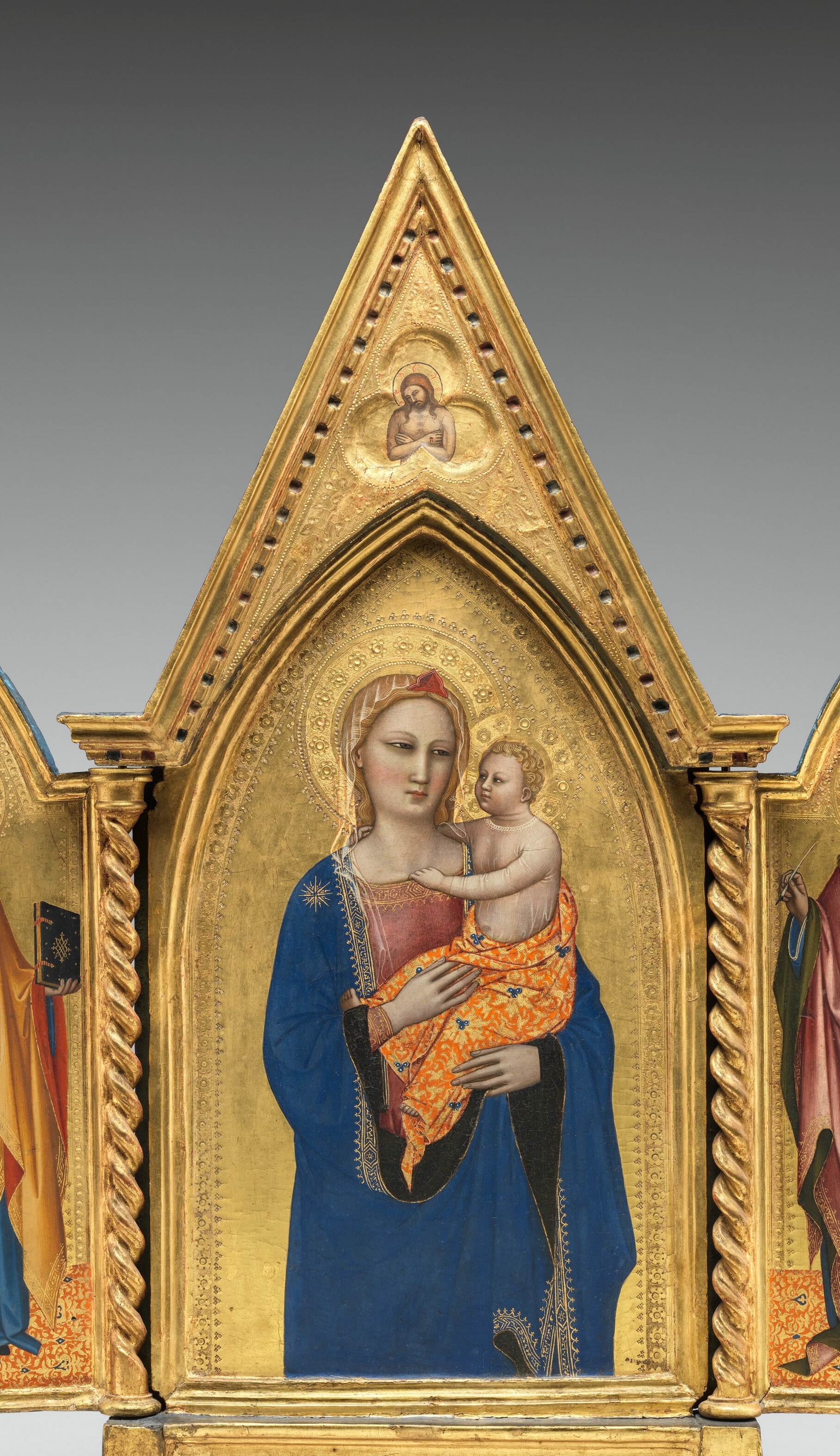 The arch literalises the idea of a heavenly portal , the viewer gazes through architecture into sacred space; the foliate cusps are gilded throughout