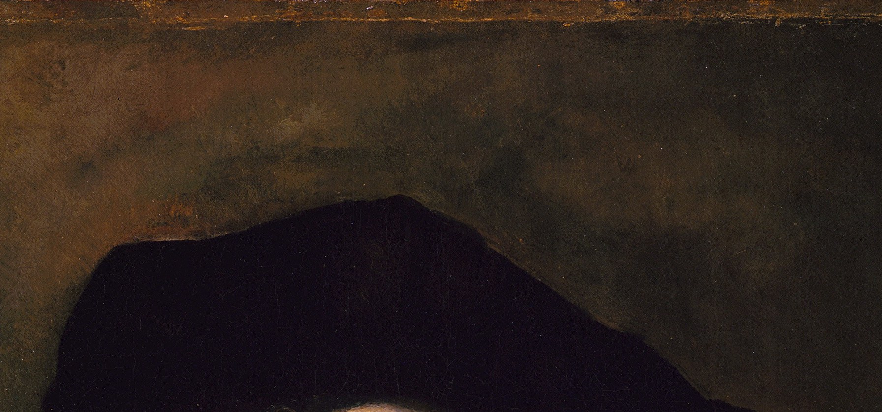 The signature dark cap dissolves at its edges into the background , a deliberate Rembrandt blur that anchors the figure in shadow rather than silhouetting it against light.
